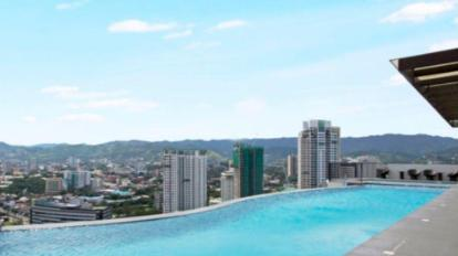 Rooftop infinity pool — elevated city outlook